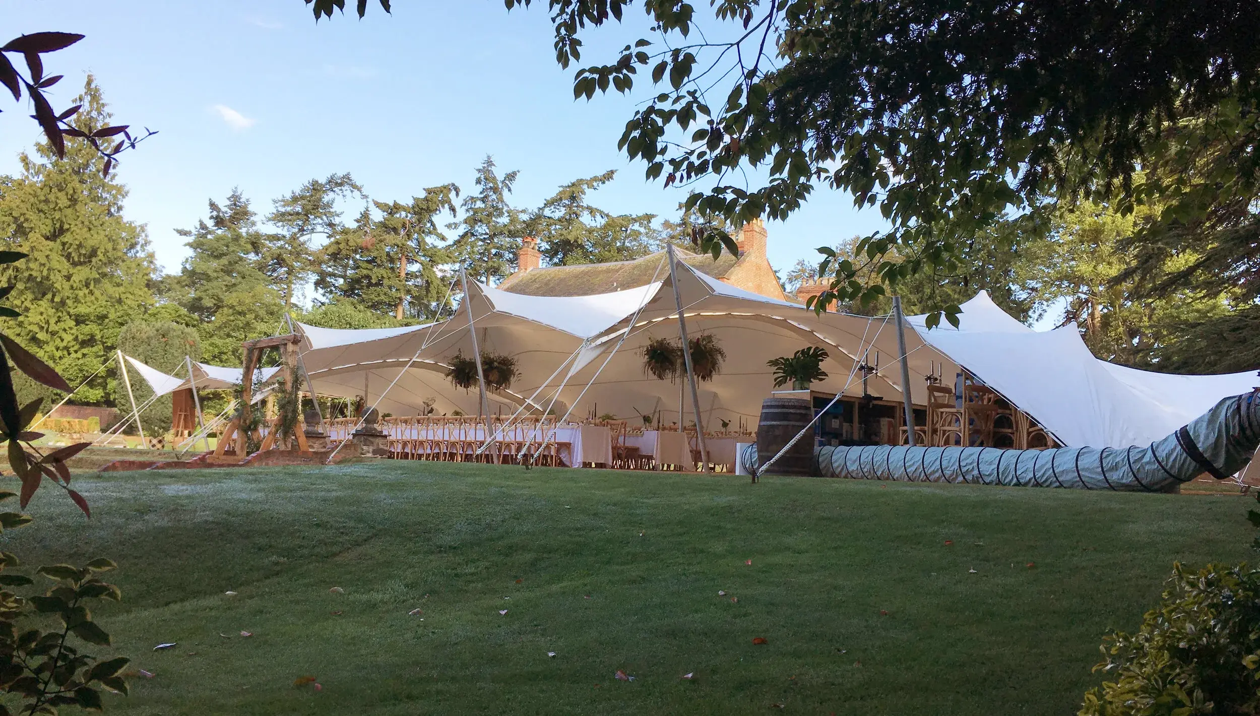 Split stretch tent with central ceremony space - wedding marquee hire Oxfordshire